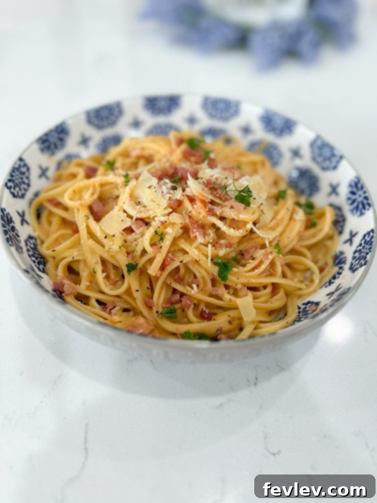 Overhead view of a prepared dish of bacon tomato pasta, inviting and comforting