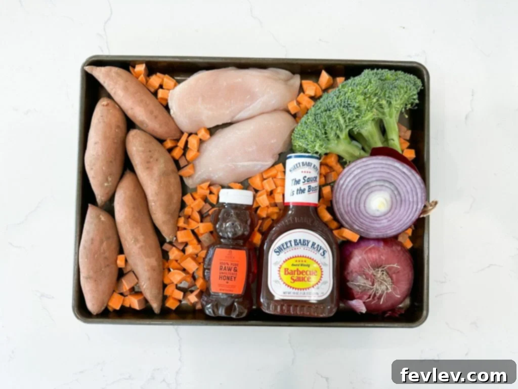 Delicious Sheet Pan BBQ Chicken and Vegetables with perfectly cooked chicken, sweet potatoes, and broccoli.