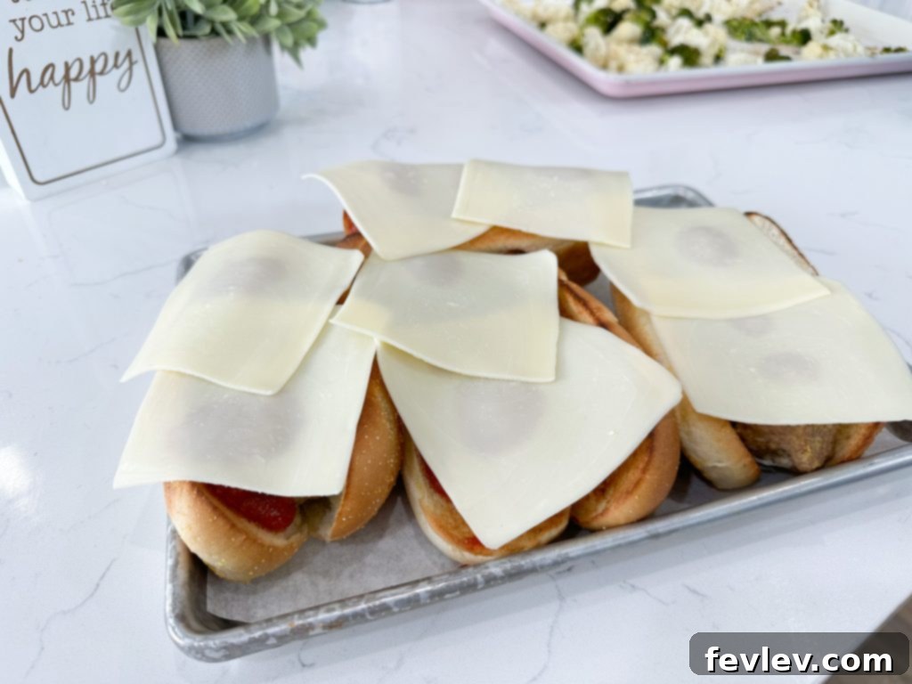 Toasted hoagie rolls waiting for assembly of turkey meatball subs.