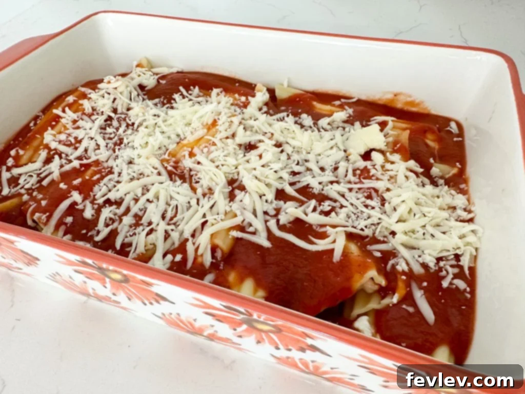filling manicotti with cheese mixture