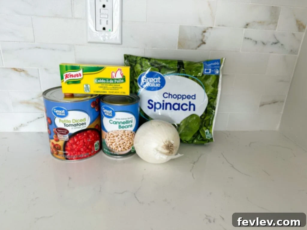 Delicious White Bean and Spinach Soup in a bowl, garnished with Parmesan