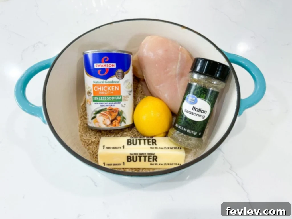 Delicious One Pot Lemon Chicken and Rice served in a large Dutch oven, ready to be enjoyed.