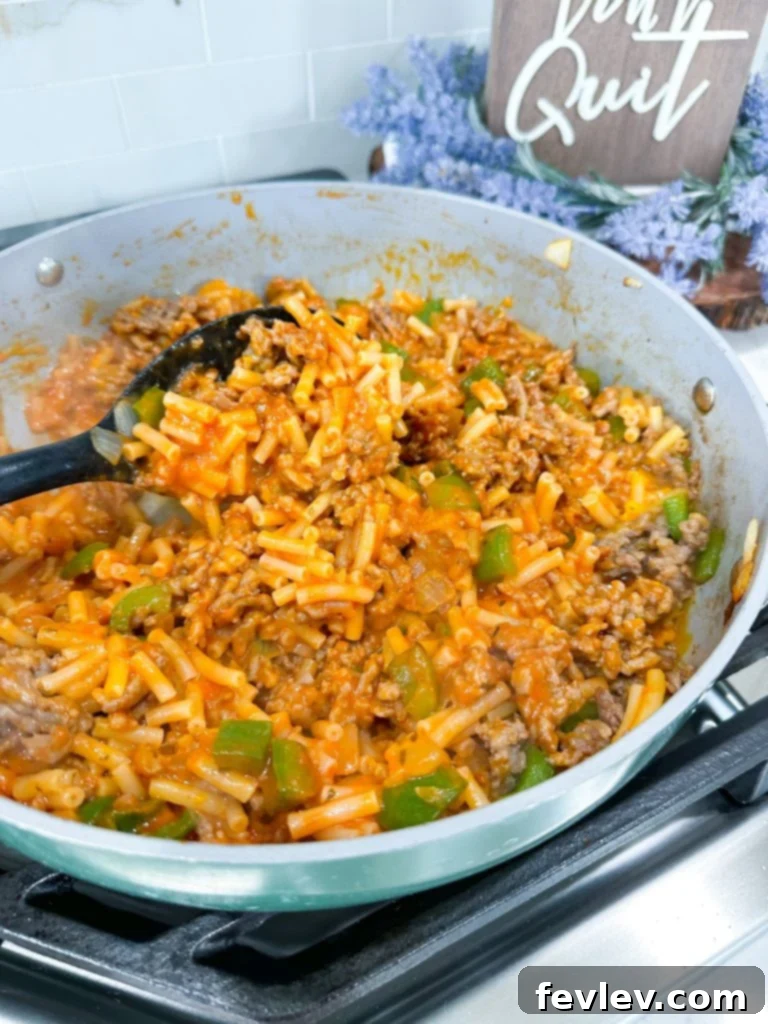 Close-up of Macaroni and Cheese Pizza Casserole showing rich toppings