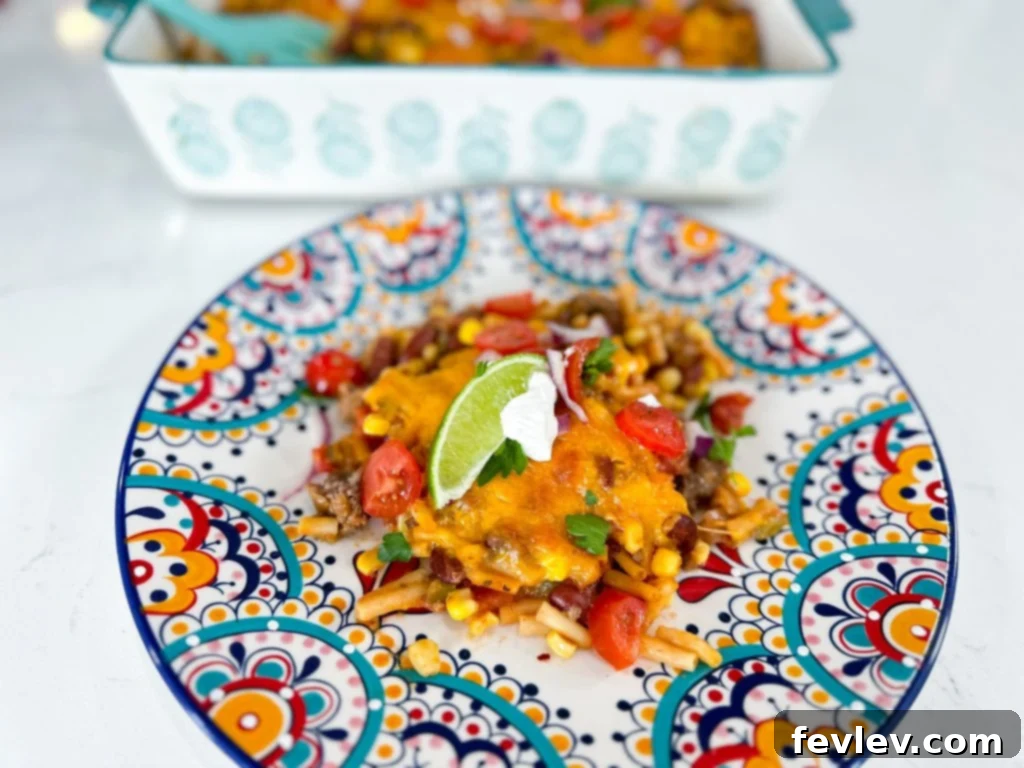 Fiesta Macaroni Bake 3 Close-up of Southwest Mexican Macaroni and Cheese Casserole with melted cheese and fresh cilantro garnish