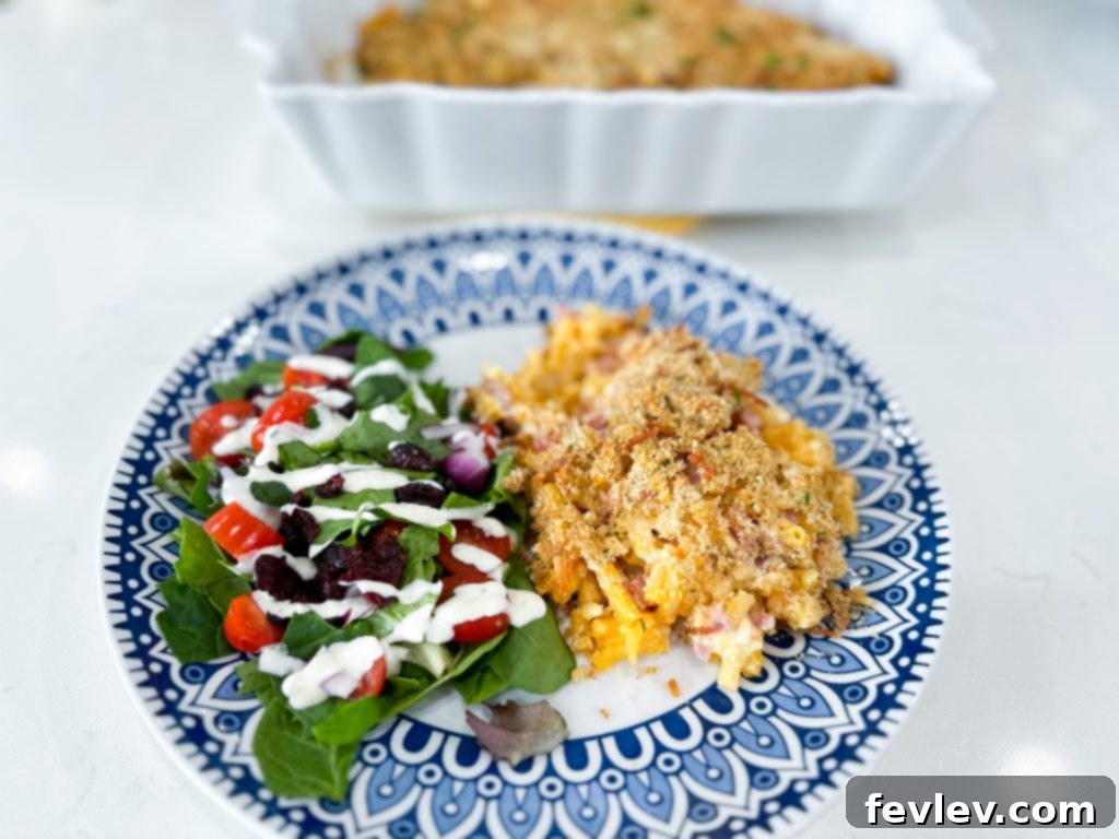 A serving of Cheesy Ham Macaroni and Cheese Casserole on a plate