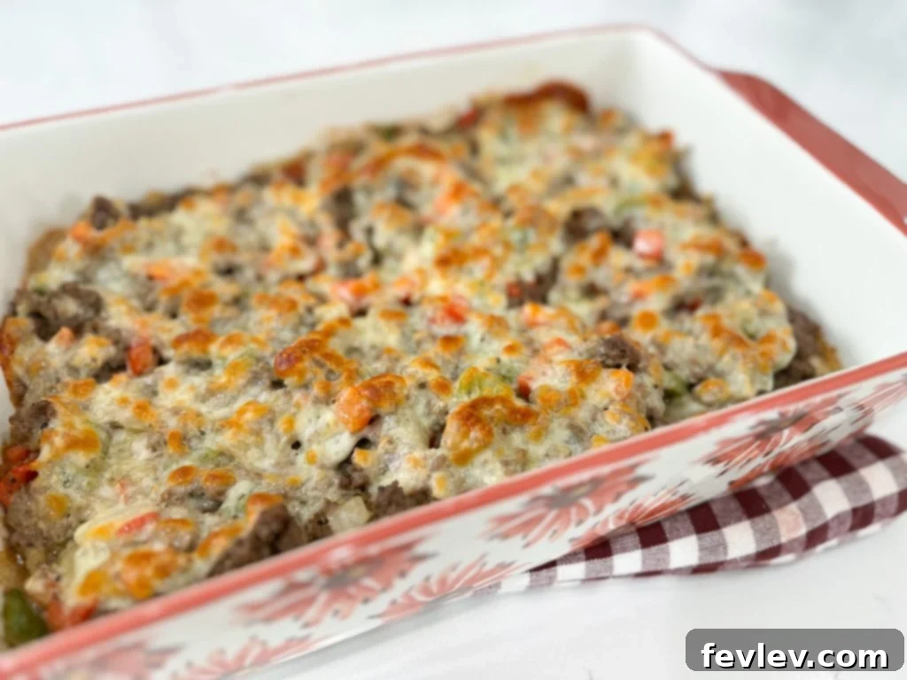 Cheesy Philly Cheesesteak Bake 5 philly cheesesteak casserole with melted provolone cheese fresh out of the oven