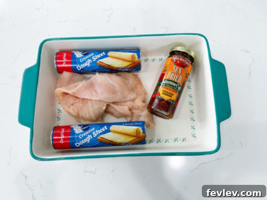 Golden Crescent Chicken with Sun-Dried Tomato Cream 5 Chicken Wrapped in Crescent Rolls with Sun-Dried Tomato Cream Sauce #chicken #oven-baked