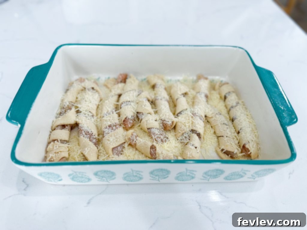 Golden Crescent Chicken with Sun-Dried Tomato Cream 7 Wrapped chicken placed in baking dish.