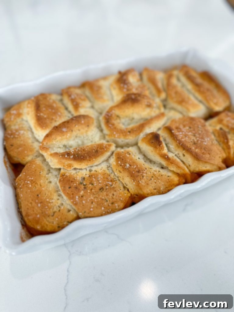 Close-up of baked Italian Sausage Biscuit Casserole with golden biscuits
