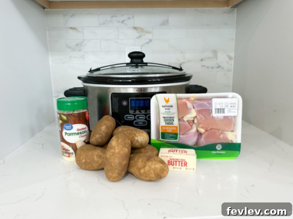Garlic Butter Chicken Thighs with Potatoes in a slow cooker, ready to serve.