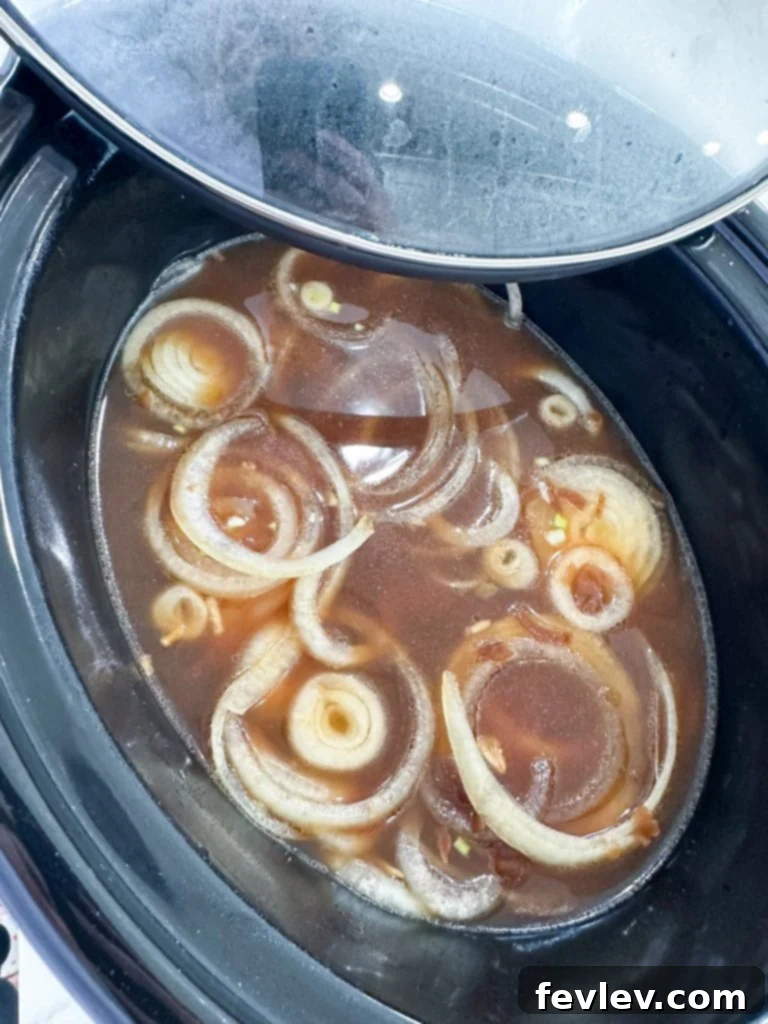 An empty slow cooker prepared with a non-stick liner, ensuring easy cleanup, ready for the ingredients to be added.