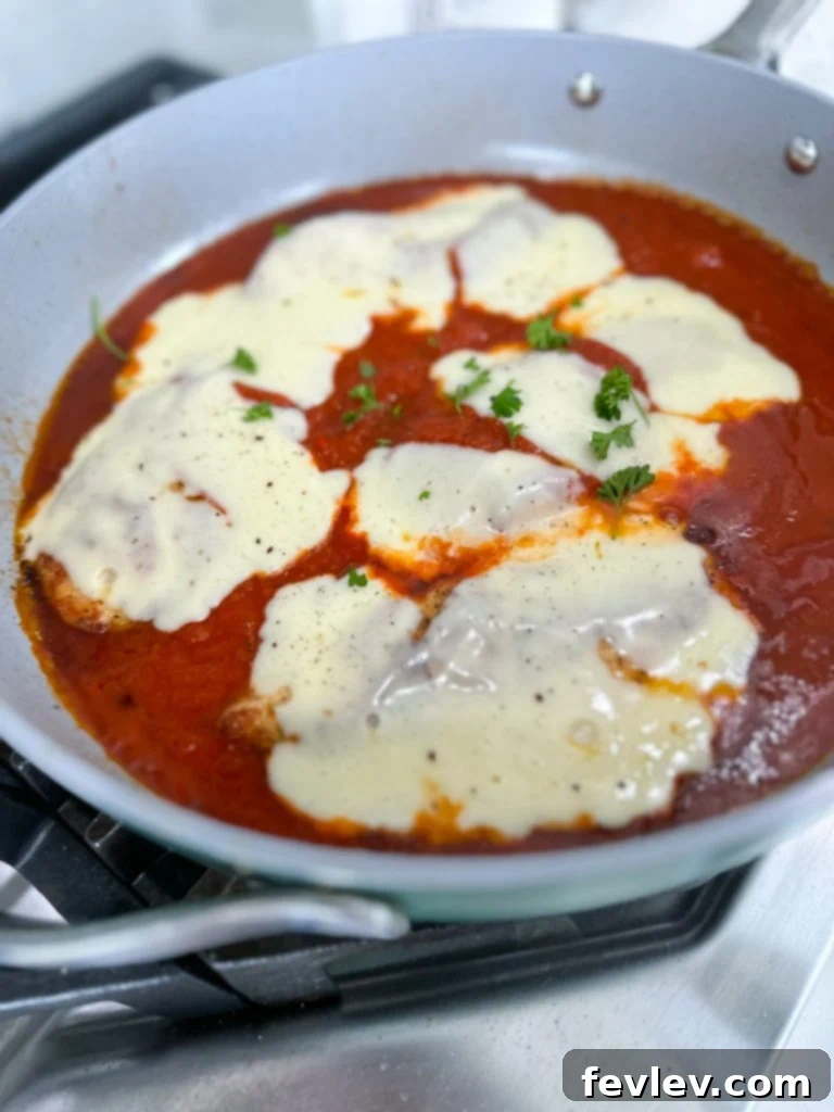 All ingredients for Chicken Mozzarella Pasta laid out on a kitchen counter, ready for preparation