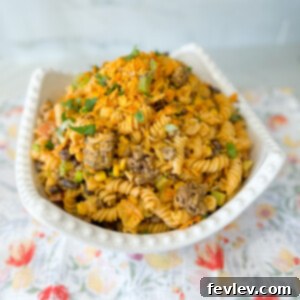 Doritos Taco Pasta Salad with ground beef, pasta, and fresh vegetables.