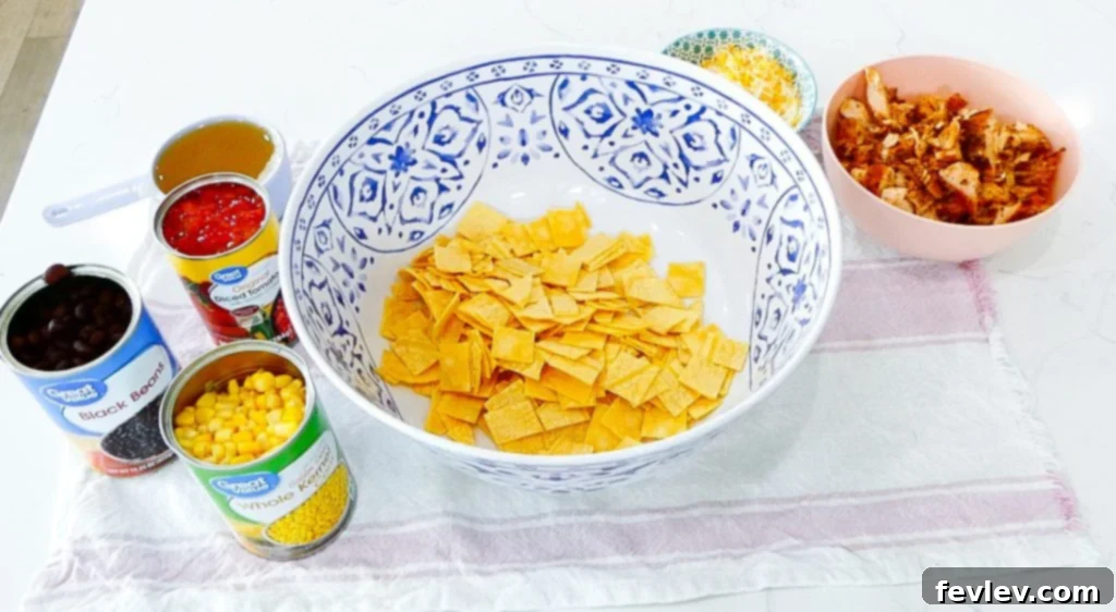Cheesy Chicken Tortilla Bake 6 Step 3: Pouring canned corn into the mixing bowl