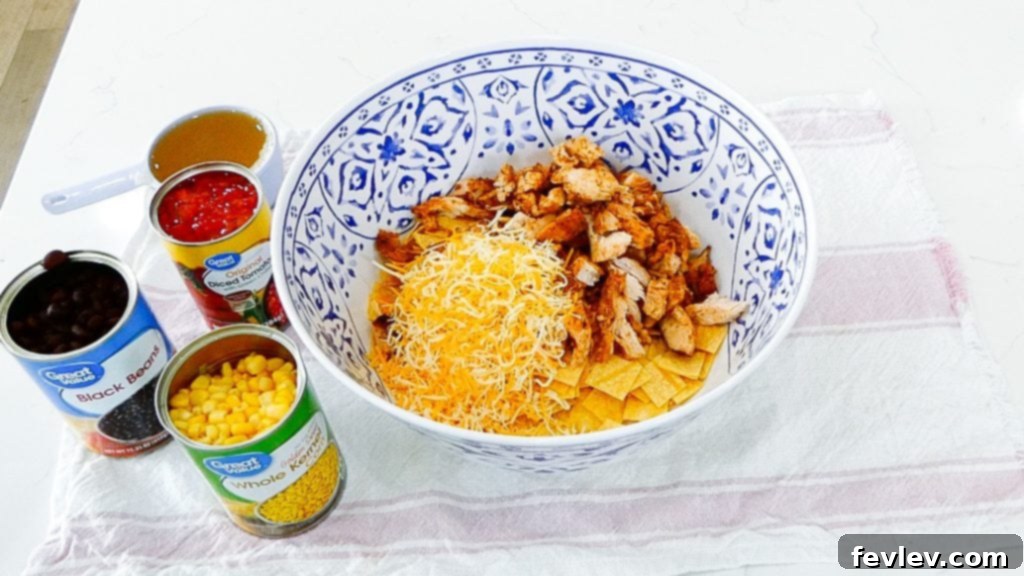 Cheesy Chicken Tortilla Bake 8 Step 5: Mixing all ingredients thoroughly in a large bowl