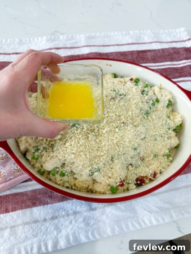 Sprinkling Panko breadcrumbs over the casserole