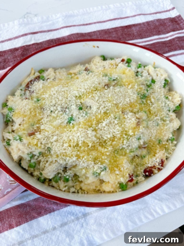 Drizzling melted butter over the Panko breadcrumbs