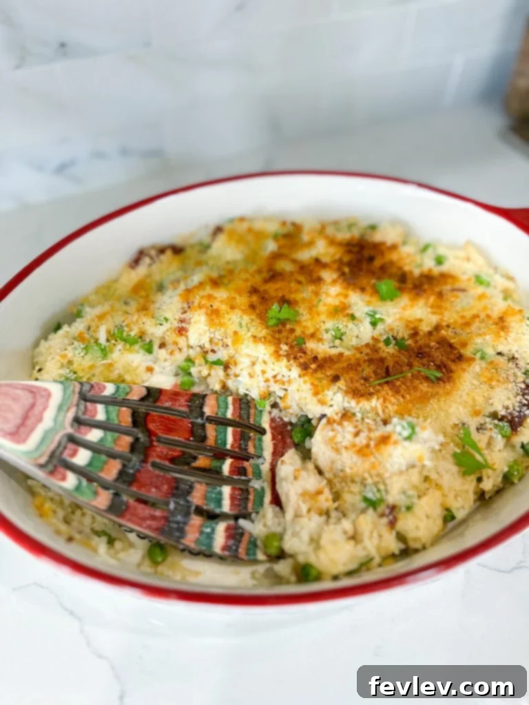 Serving of Chicken Alfredo Rice Casserole with a side salad