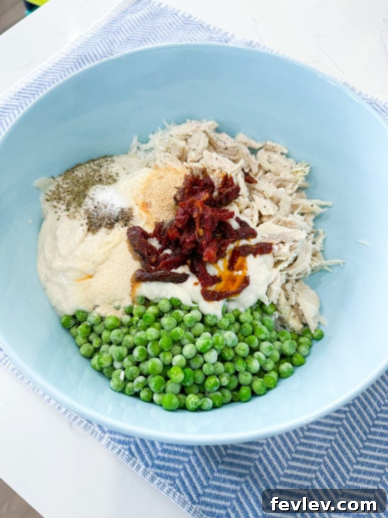 Frozen peas being added to the mixture