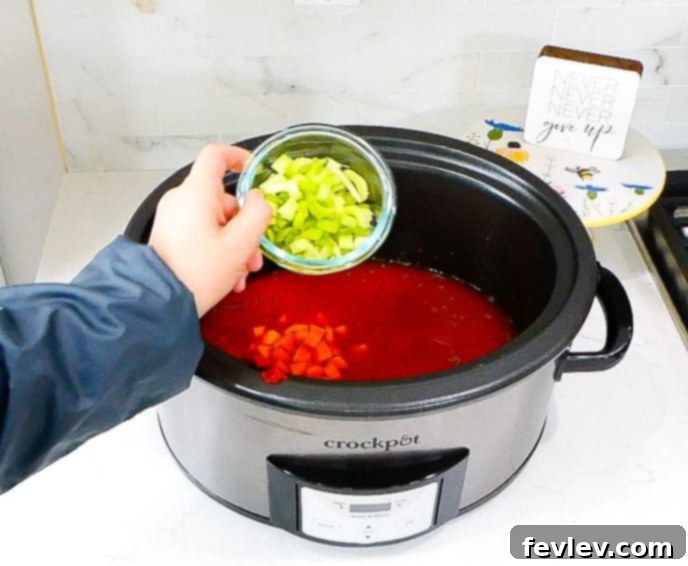 Hearty Slow Cooker Beef Ragu 7 slow cooker filled with ingredients for beef ragu