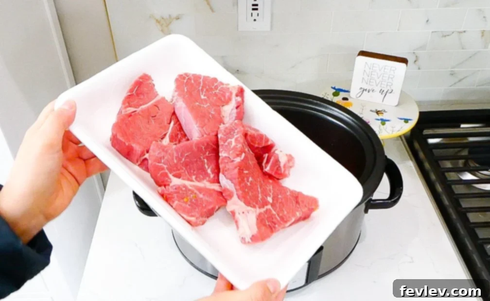 Hearty Slow Cooker Beef Ragu 8 chuck roast added to slow cooker