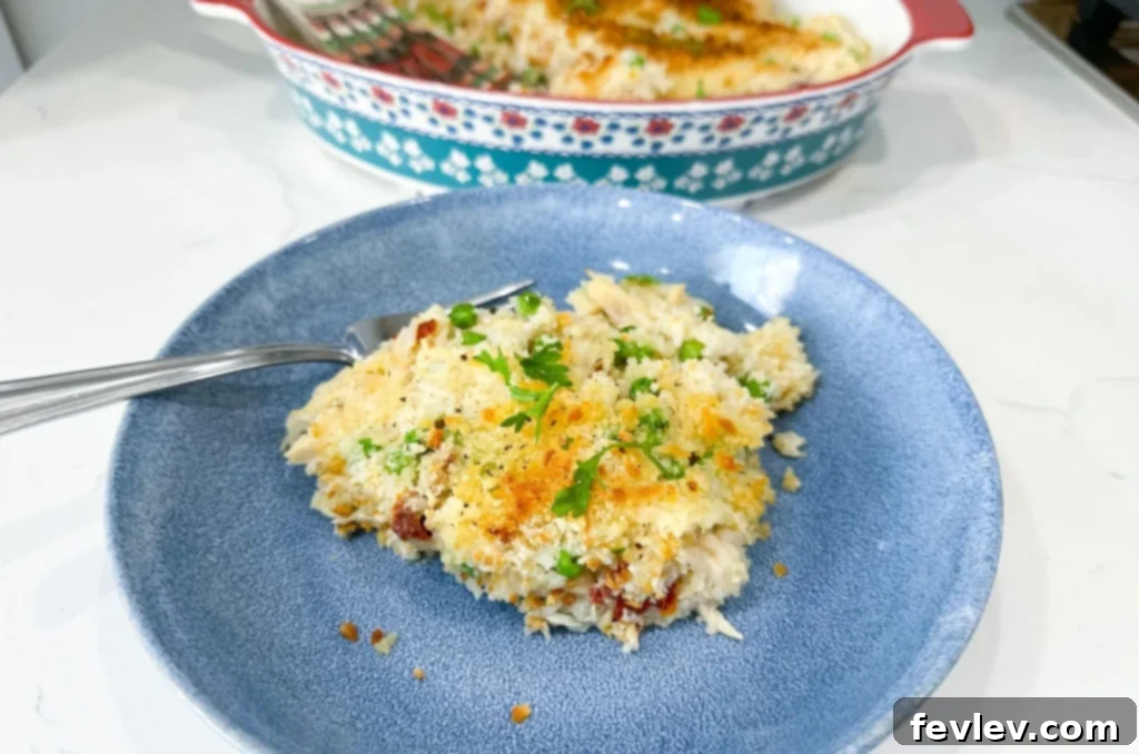 Creamy Chicken Alfredo Rice Casserole with sun-dried tomatoes and panko topping