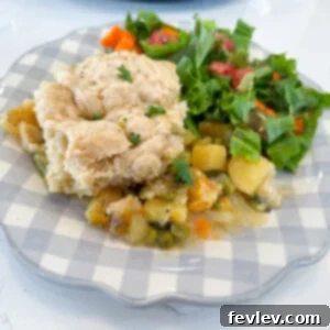 Delicious Slow Cooker Vegetable Pot Pie with flaky biscuit topping