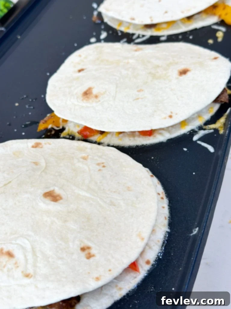 Freshly cooked steak fajita quesadilla sliced and ready to serve