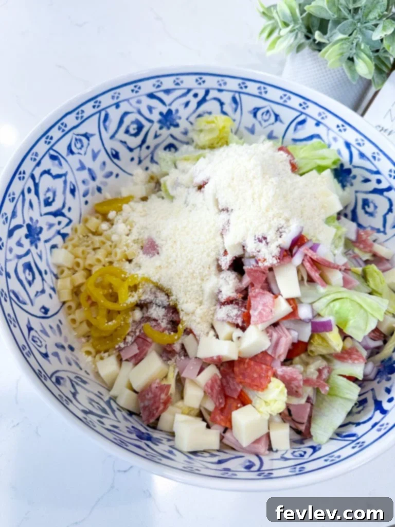 Loaded Italian Grinder Pasta Salad 7 Crisp iceberg lettuce, finely chopped for the pasta salad.
