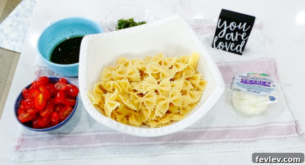 Fresh Caprese Pasta Salad with Zesty Balsamic 6 Rinsing pasta with cold water to cool it down.