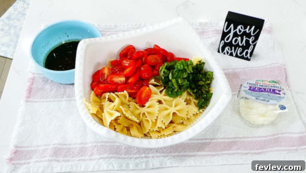 Fresh Caprese Pasta Salad with Zesty Balsamic 9 Whisking balsamic vinaigrette dressing ingredients.