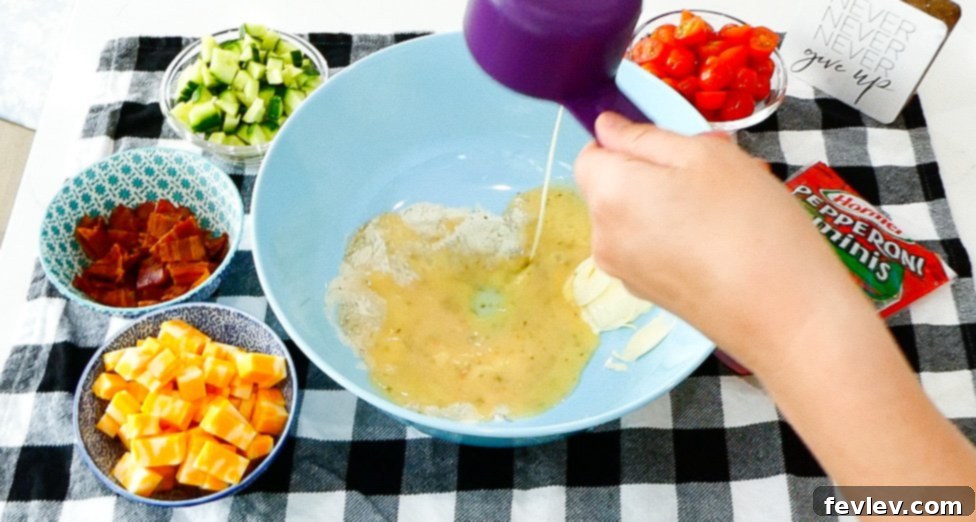 Ranch Kissed Italian Pasta Salad 6 Cubed cheddar cheese and mini pepperoni, key ingredients for the Italian Ranch Pasta Salad, offering rich flavor and savory bites.