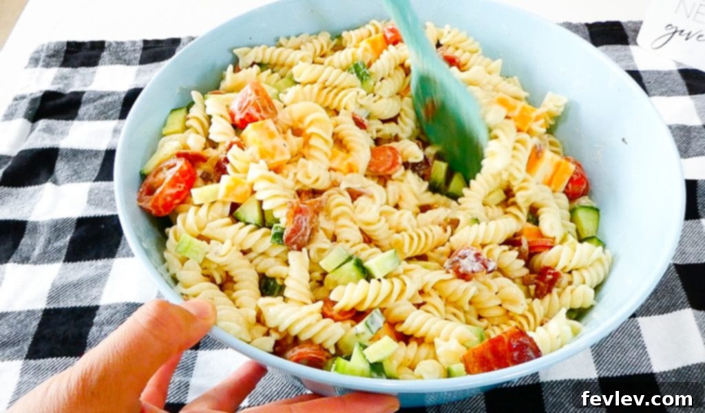 Ranch Kissed Italian Pasta Salad 9 The finished Italian Ranch Pasta Salad, beautifully mixed and ready to be chilled, showcasing all the colorful ingredients.