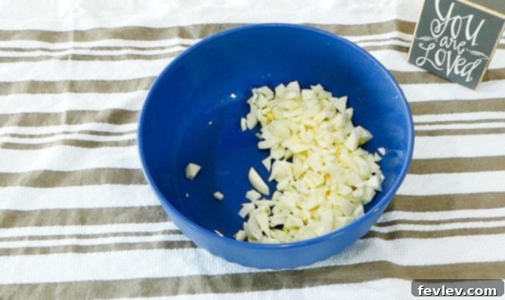 All ingredients combined in a large bowl, being stirred.