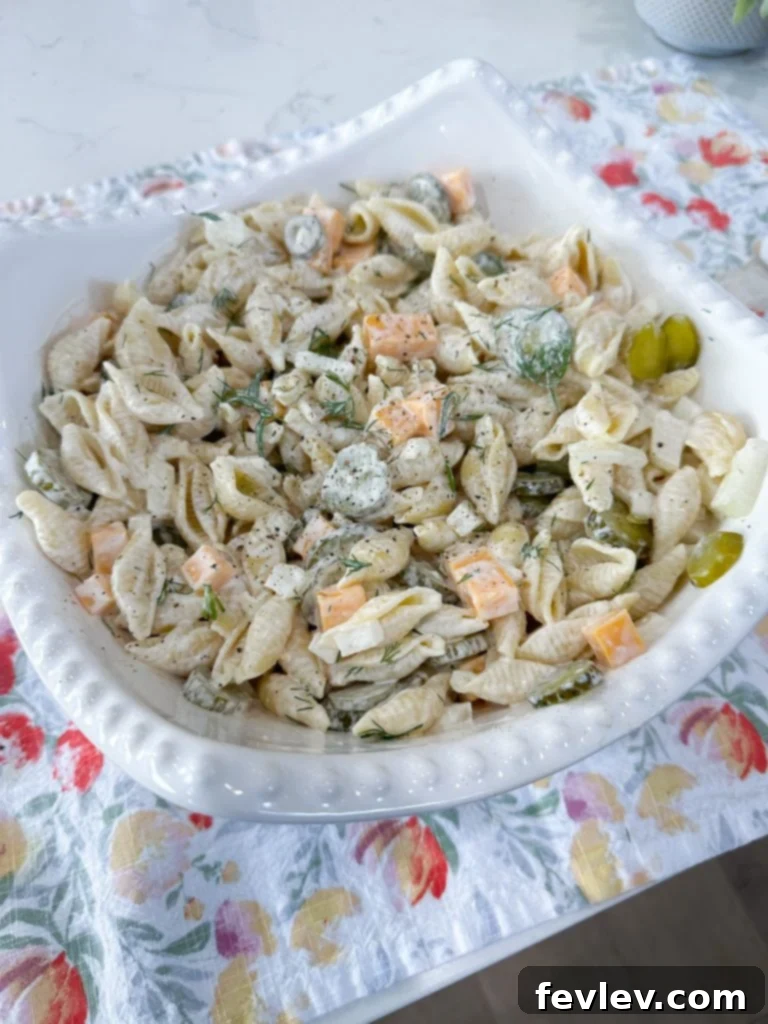 Close-up of creamy dill pickle pasta salad ingredients