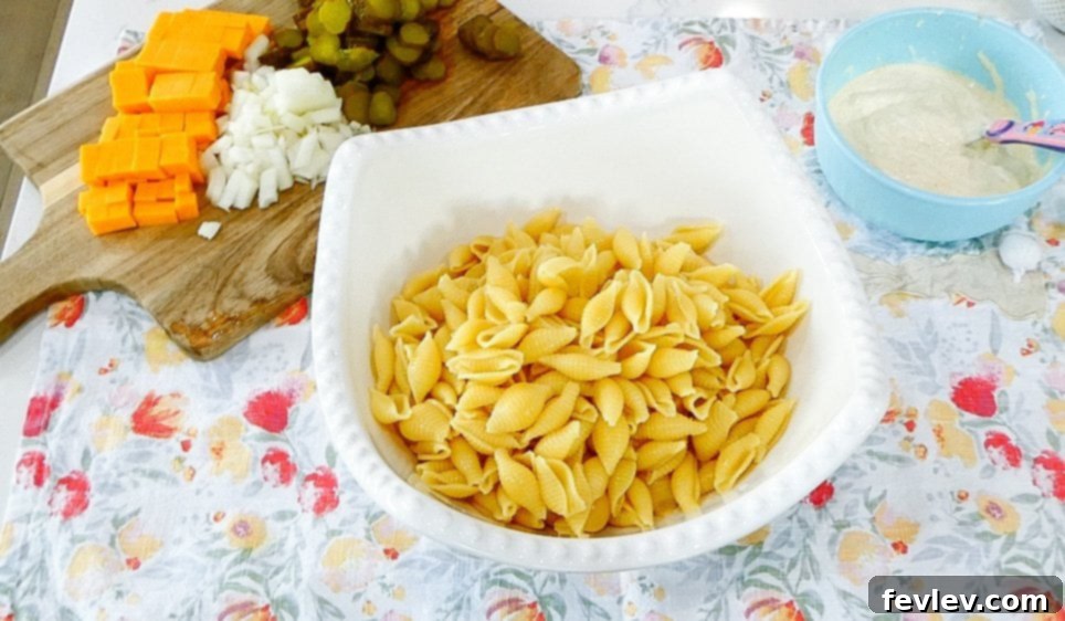 Mixing pasta and ingredients in a large bowl