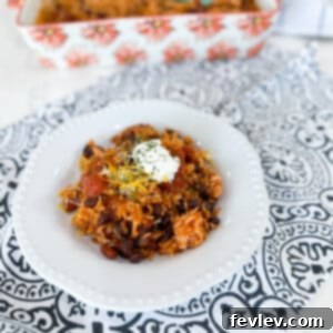 Delicious and hearty Rice and Bean Casserole garnished with fresh cilantro