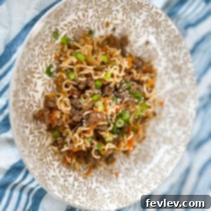 Delicious Slow Cooker Beef Teriyaki Ramen with green onions and sesame seeds