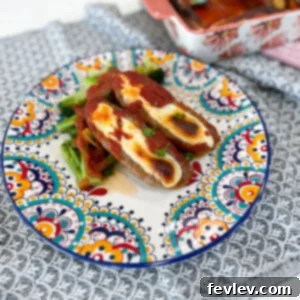 Delicious Low Carb Mozzarella Stuffed Sausage with rich pasta sauce, baked to perfection, a perfect keto-friendly dinner.
