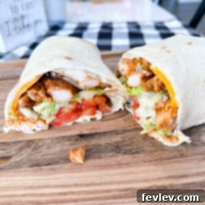 Delicious and easy Pesto Chicken Wraps, perfect for a quick lunch or dinner, featuring tender chicken, fresh pesto, and melty cheese in a tortilla.