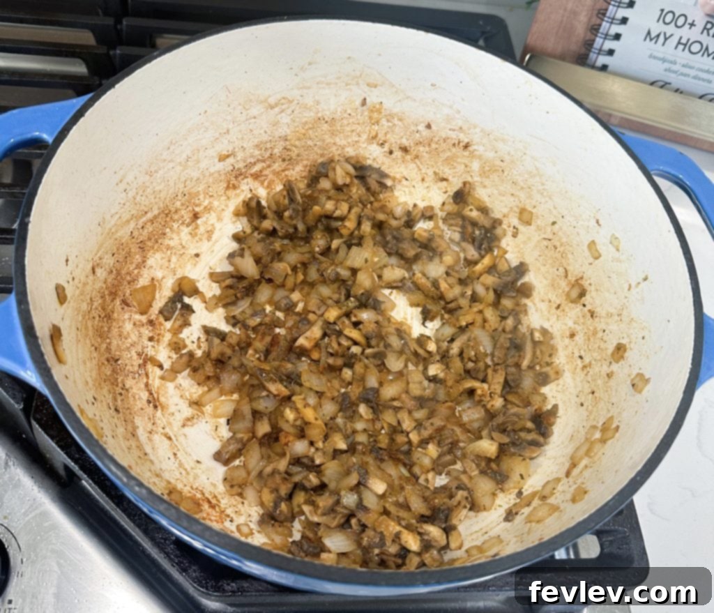 Quick & Creamy One-Pot Chicken Stroganoff 4 Cooking mushrooms and onions for stroganoff