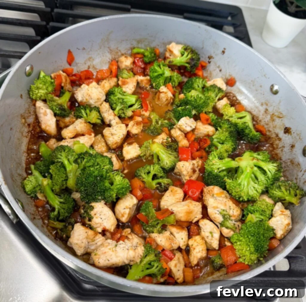 Effortless Chicken & Veggie Delight 3 Small bowl with homemade stir fry sauce, perfectly whisked and ready to be added to the stir fry