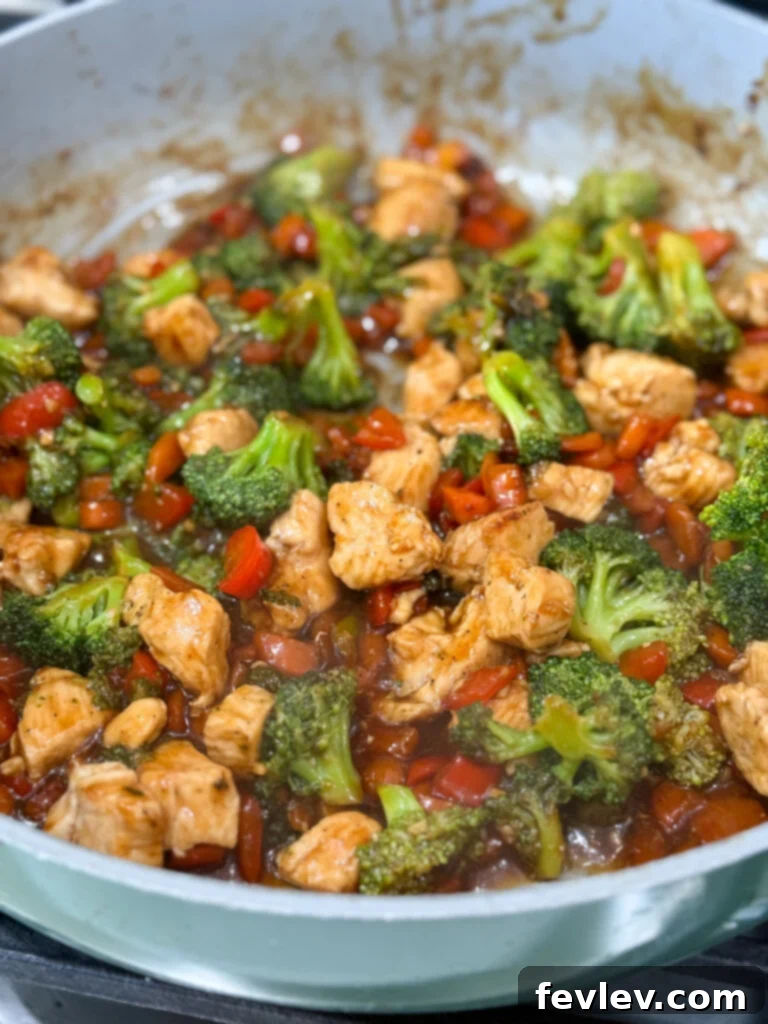 Effortless Chicken & Veggie Delight 4 Close-up of easy and flavorful chicken and vegetable stir fry simmering in a thick, glossy sauce