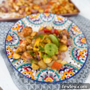 Delicious Sheet Pan Taco Salsa Chicken and Vegetables with vibrant colors, served hot.