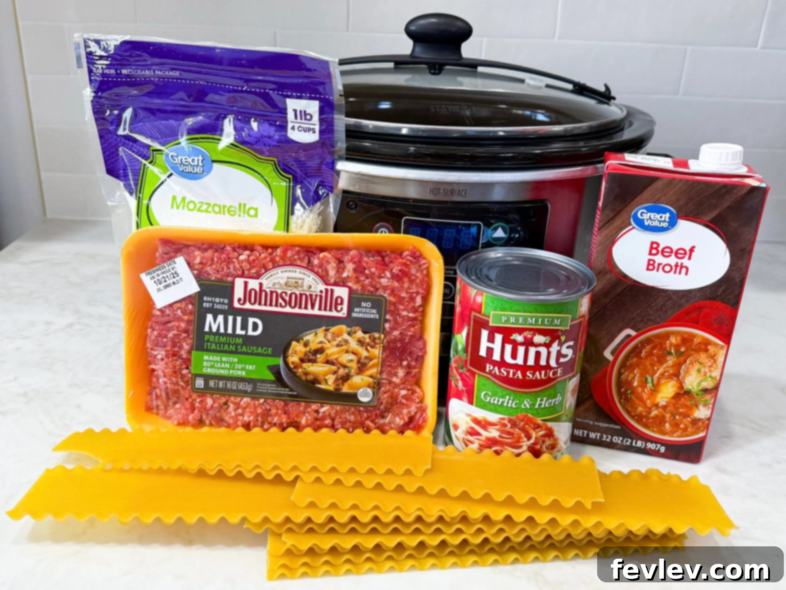 Ingredients for slow cooker lasagna soup laid out on a kitchen counter