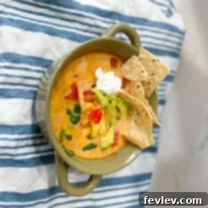 Delicious Creamy Tortilla Soup garnished with fresh cilantro and avocado