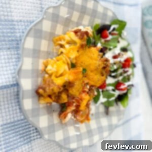 Delicious Sour Cream Noodle Bake, a creamy and cheesy pasta casserole with Italian sausage
