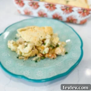 Delicious Chicken Cobbler, a savory bake with creamy chicken and fluffy biscuit topping.