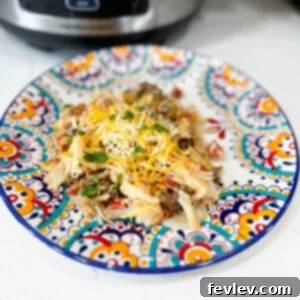 Delicious Slow Cooker Potato Taco Casserole, a cheesy Tex-Mex comfort dish
