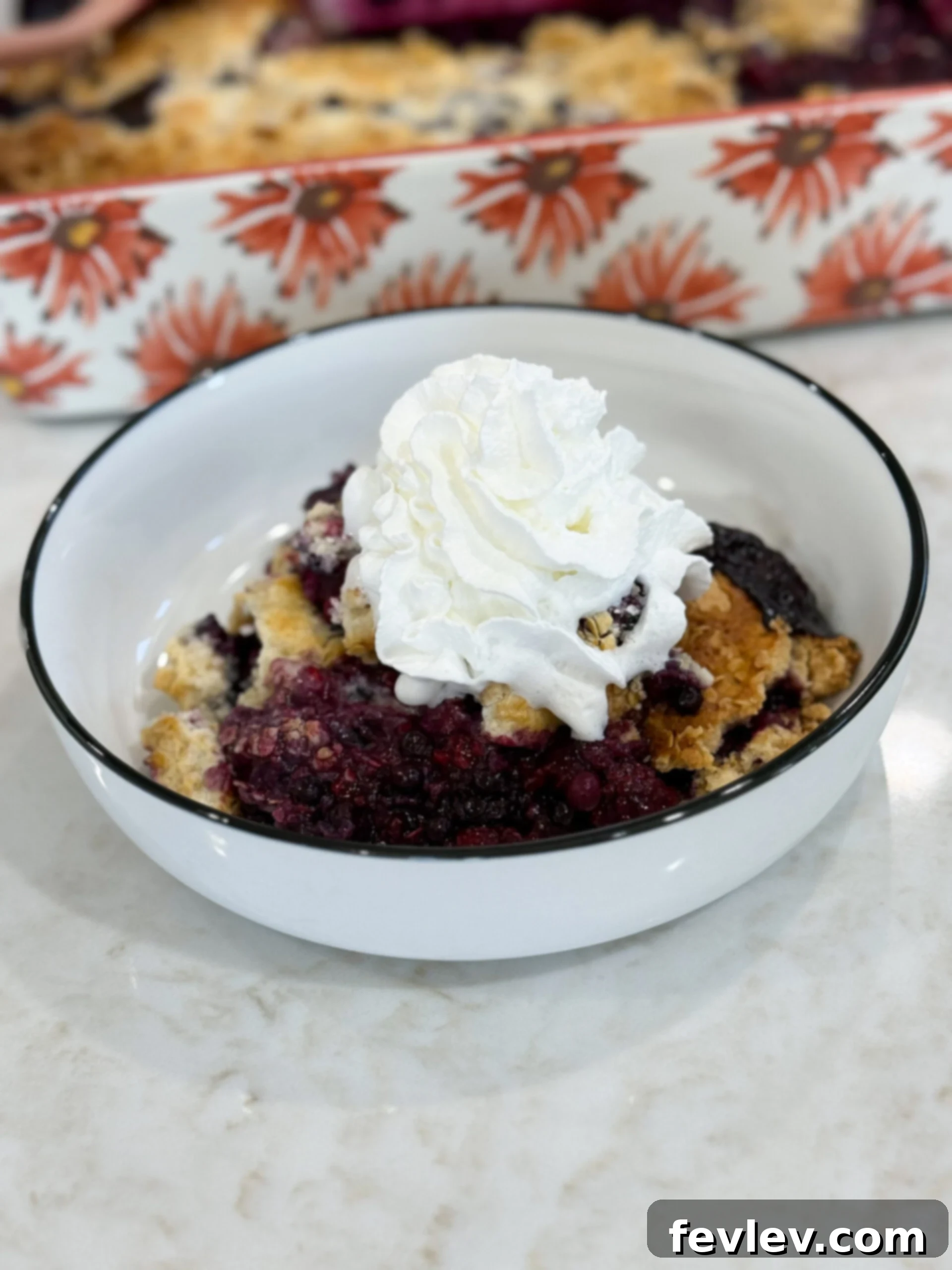 Perfect Homemade Berry Cobbler 2 Easy Berry Cobbler — warm, buttery, and packed with sweet berries, served in a rustic dish.